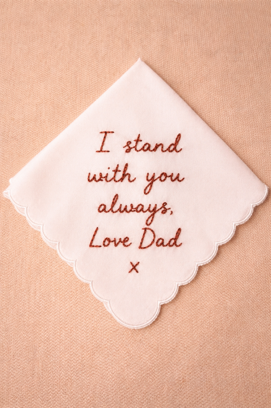 Embroidered handkerchief with 'I stand with you always, Love Dad' text on a beige background